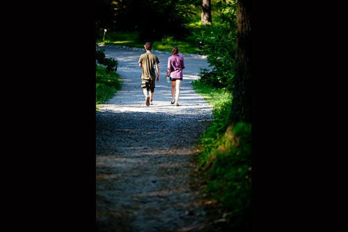 Lover's lane: A couple meanders through the Arboretum.