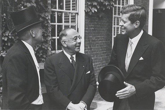 In 1959, Sen. John F. Kennedy, Class of 1940, attended Harvard's Commencement. Kennedy spoke with Harvard Treasurer Paul C. Cabot (left) and Sidney Weinberg, senior partner at Goldman Sachs, who received an honorary degree that day. 