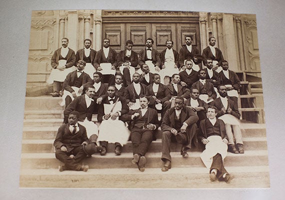 An 1875 photograph of waiters at Harvard’s Memorial Hall. Photos by Stephanie Mitchell/Harvard Staff Photographer