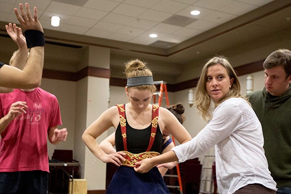 Artistic associate at the A.R.T. Allegra Libonati (white shirt) is the play's director. Here, she helps actress Rebecca Strimaitis adjust her costume. Photos by Kris Snibbe/Harvard Staff Photographer