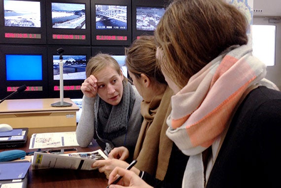 Karina Gilbert (from left), Maria Arrasate, and Elise Baudon converse at the Tohoku Regional Bureau of the Ministry of Land, Infrastructure, Transport and Tourism. Photo courtesy of Trevor Johnson