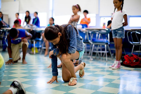 Nhu Xuan Le, 11, practices her part in the dance routine.