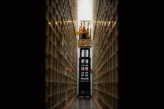 A journey down a single aisle on the lift — the same kind used at Home Depot — is only 200 feet, yet travels past 400,000 books on 2,000 shelves.