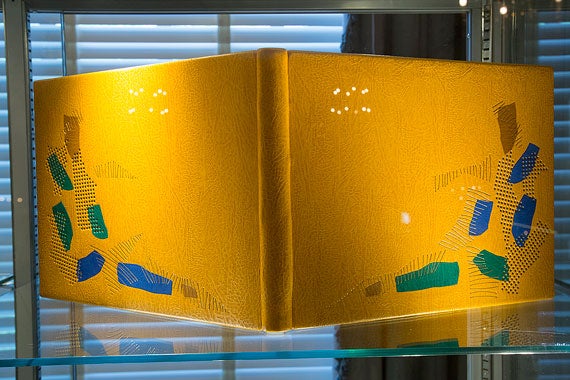 Dominic Riley bound Richard Barnfield's "Sonnets" in mustard goatskin with brown, blue, and green goatskin onlays. 

