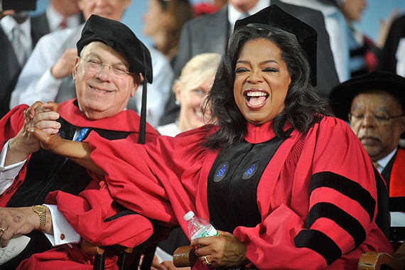 During Morning Exercises, honorands Oprah Winfrey and Boston Mayor Thomas M. Menino shared a moment. File photo by Jon Chase/Harvard Staff Photographer