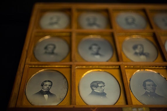 A detail image of the members of the Harvard Class of 1852. A drawer holds 12 sixth-plate daguerreotypes, each measuring 2.75 inches by 3.25 inches. Photos by Stephanie Mitchell/Harvard Staff Photographer