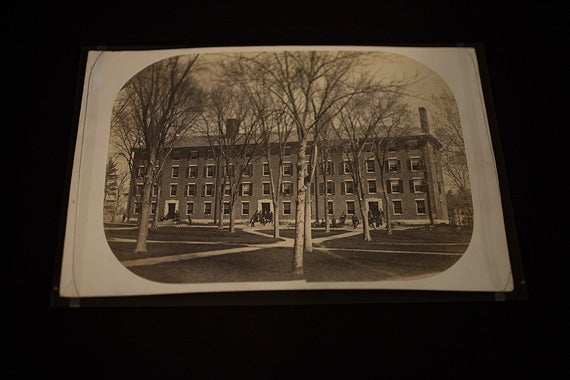 A class album featuring a photograph of Harvard Yard by George Kendall Warren.