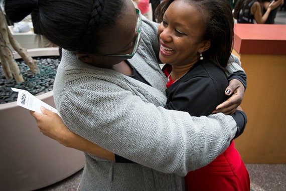 Nicole Jackson (right) learns she's going to Boston University Medical Center in Boston. Photo by Rose Lincoln/Harvard Staff Photographer