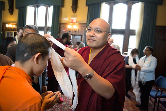 During a meeting with the Buddhist Ministry Initiative at Harvard Divinity School (HDS), his Holiness the 17th Gyalwang Karmapa gave a blessing to Priya Rakkhit Sraman, an HDS student who is a Buddhist monk from Bangladesh. Photos by Kris Snibbe/Harvard Staff Photograhper