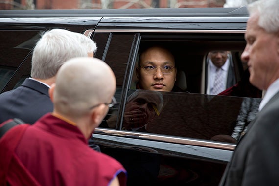 The 17th Gyalwang Karmapa was escorted out of his car by security prior to a walking tour of Harvard Yard.