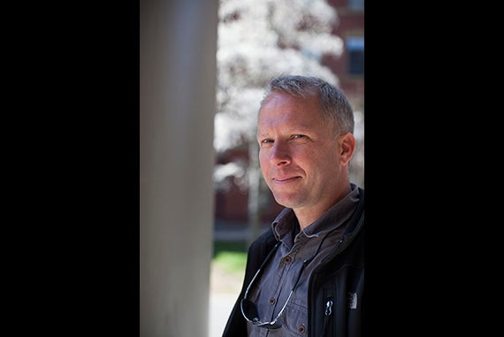 Reuters photographer Brian Snyder is pictured in Harvard Yard. Photo by Stephanie Mitchell/Harvard Staff Photographer