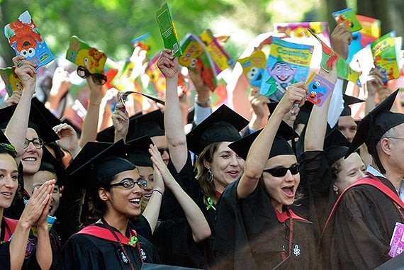 Harvard School of Education graduates celebrated by waving children’s books in 2011. “Harvard’s famous for those all-in-one good visuals,” said Boston Herald photographer Ted Fitzgerald. Photo by Ted Fitzgerald/Boston Herald