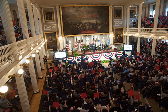 Predictions of inclement weather had prompted the event, initially dubbed “The Fenway Forum,” to relocate to the “cradle of liberty” across town, Boston’s historic Faneuil Hall. Jon Chase/Harvard Staff Photographer