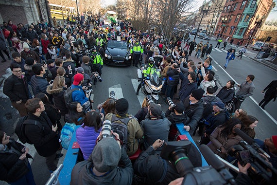 The parade draws a big crowd on Massachusetts Avenue in Cambridge. Photo by Kris Snibbe/Harvard Staff Photographer
