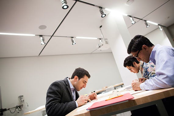 Andreas Vandris '18 (from left), Michael Perez '17, and Rohan Pavuluri '18 make their own woodcuts. Photos by Stephanie Mitchell/Harvard Staff Photographer