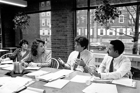 John F. Kennedy Jr. (center) and Ron Brown (far right) with students during a fall 1987 IOP Senior Advisory Committee meeting. Photo by Martha Stewart