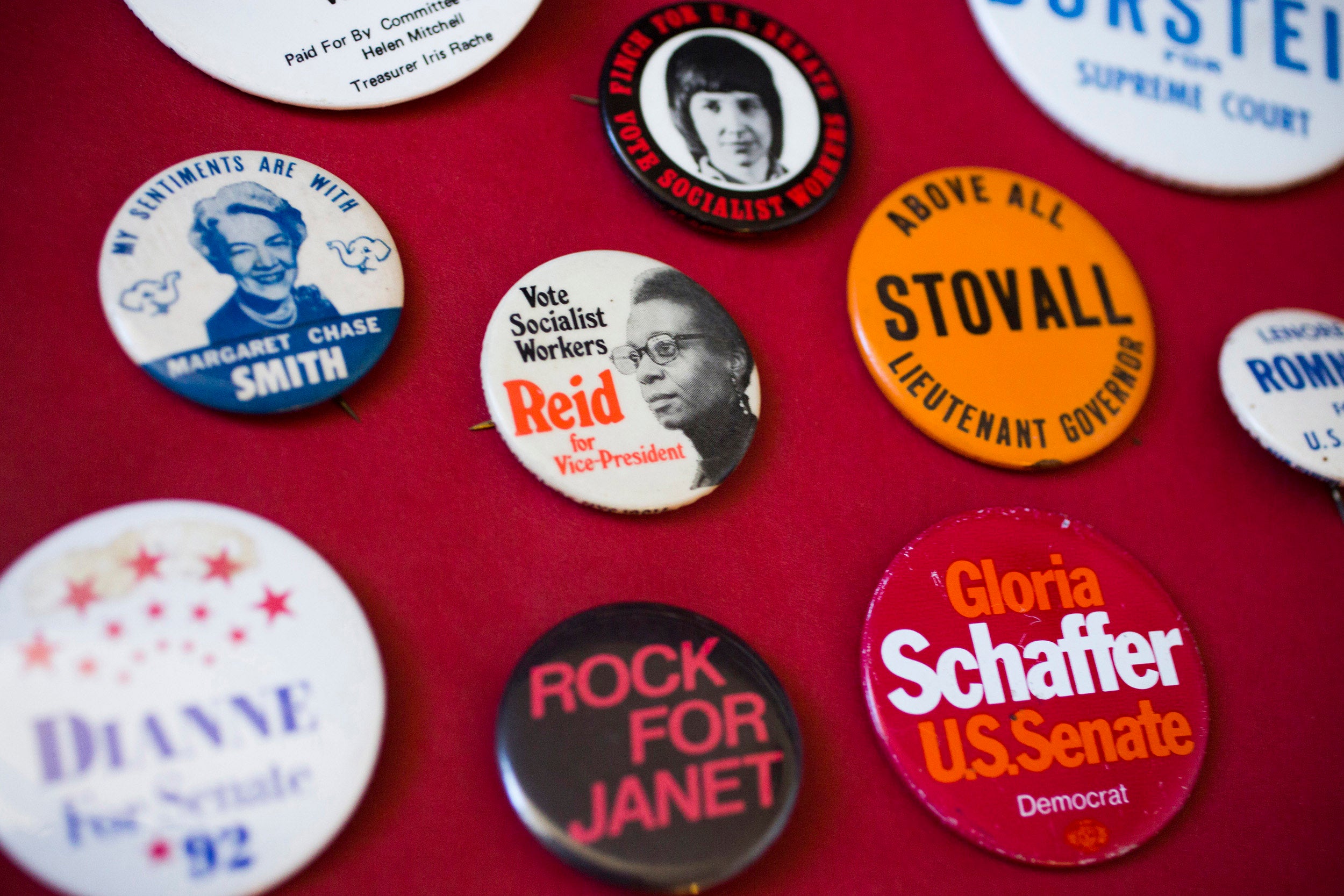 Buttons representing female candidates from conservative to socialist parties.