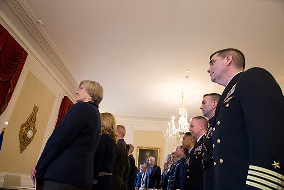 The signing took place at Loeb House. President Drew Faust (front row) was joined by Air Force officials and dozens of ROTC cadets.
