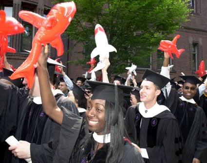 Harvard Law School graduates with inflatable sharks