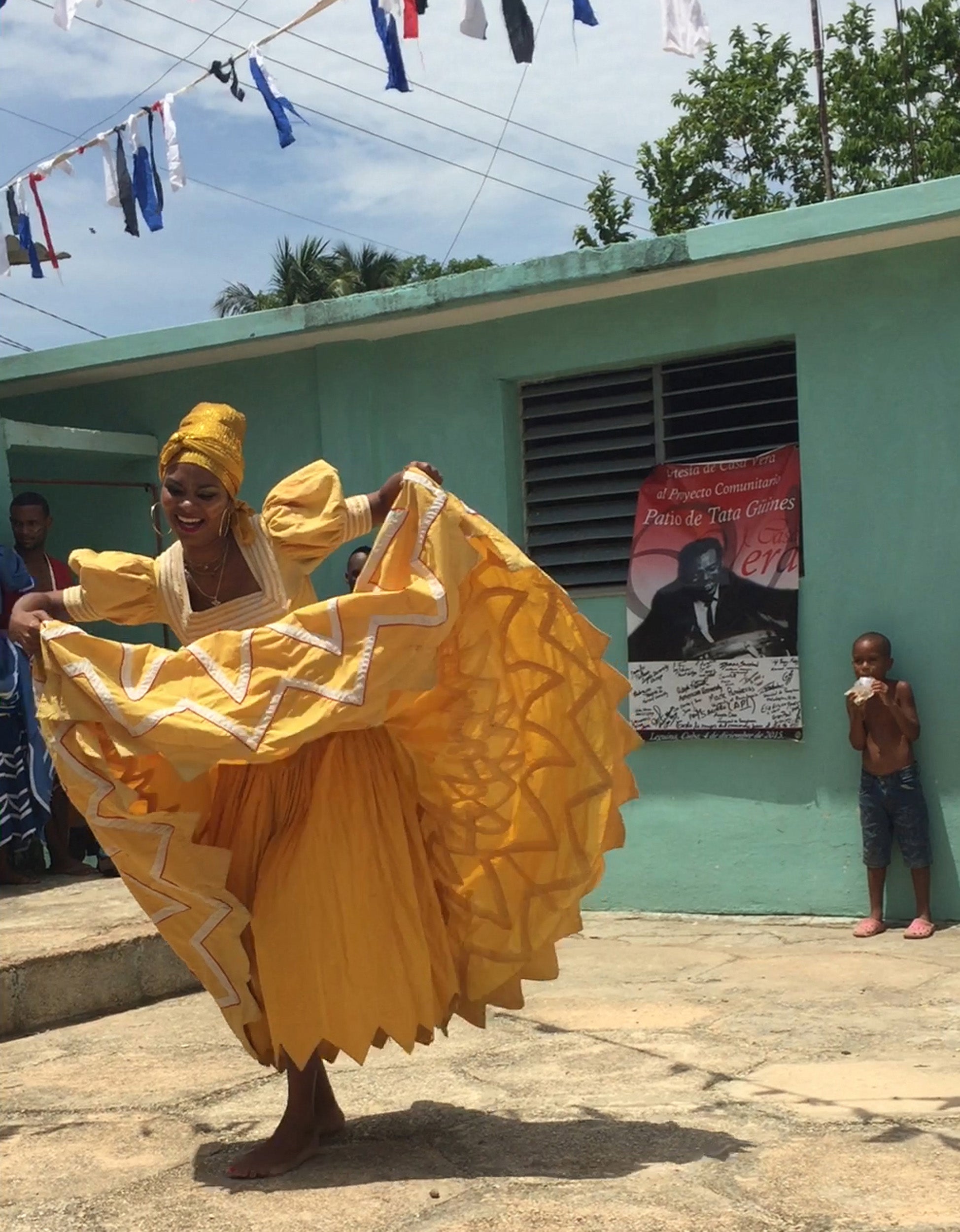 A member of the National Folkloric Company of Cuba dances in the Tata Güines museum courtyard.
