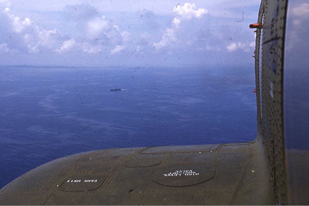 Zarins, who was flown out to the U.S. carrier, captured a shot of the South China Sea while leaning out the helicopter’s window.