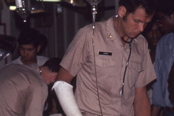 Bertram Zarins treats evacuees during the fall of Saigon.