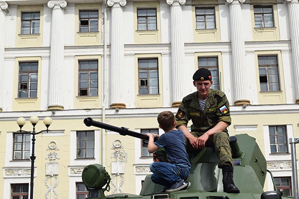 Reyes explored streets, cities and tourist spots. "By the end of the summer I felt as though I were a regular Muscovite, or something close," he said. Here a young boy talks to a Russian naval officer in Palace Square in St. Petersburg.