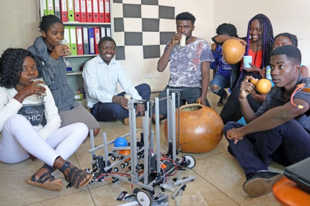 Students on the Zambian FIRST Global robotics team take a much-deserved break while working to finish construction of their robot. Photo courtesy of Sela Kasepa