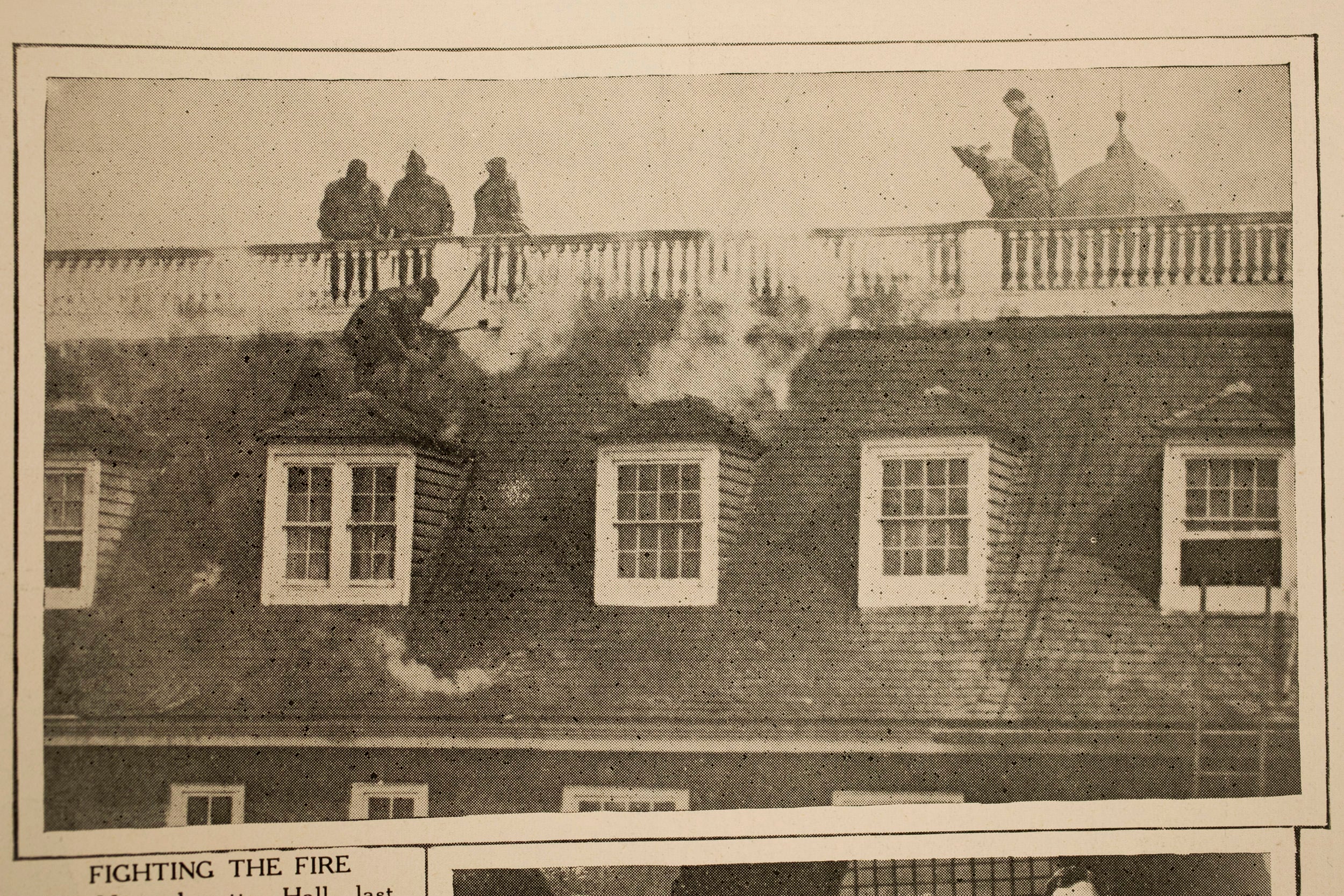 Harvard Crimson clipping shows firefighters battling Mass Hall blaze in 1924.