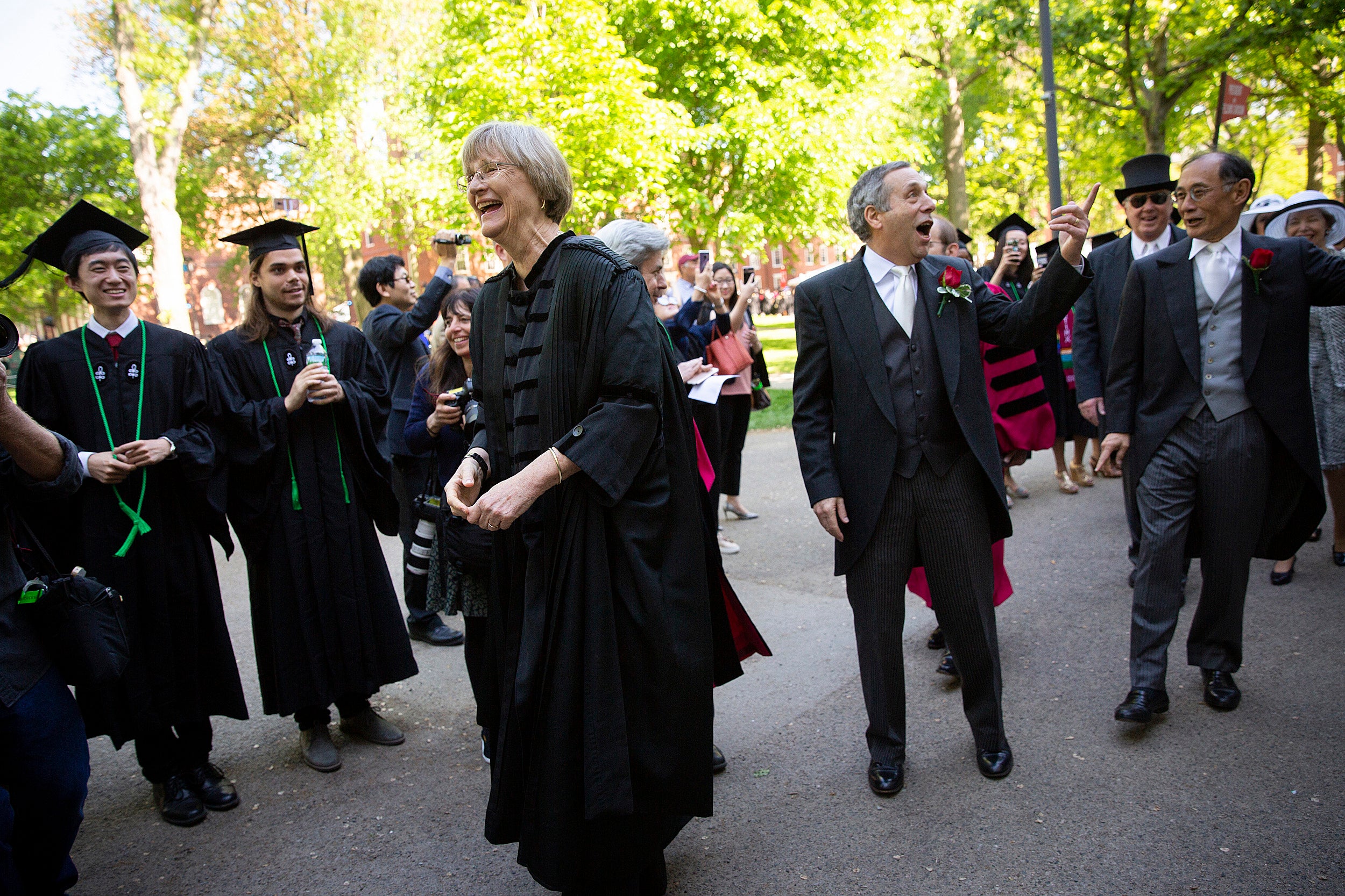 Drew Faust and Larry Bacow during commencement.