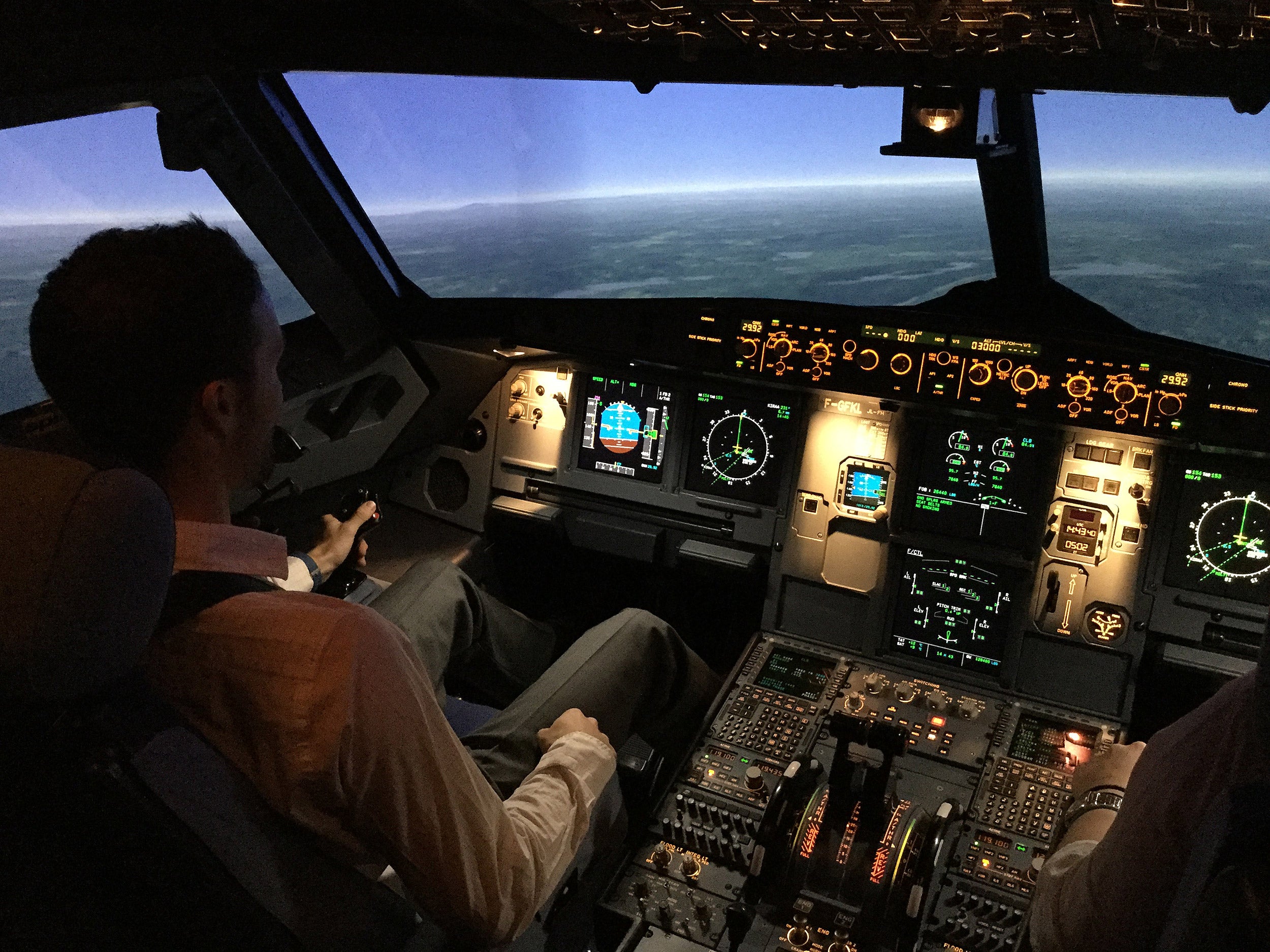 Pilot in cockpit.