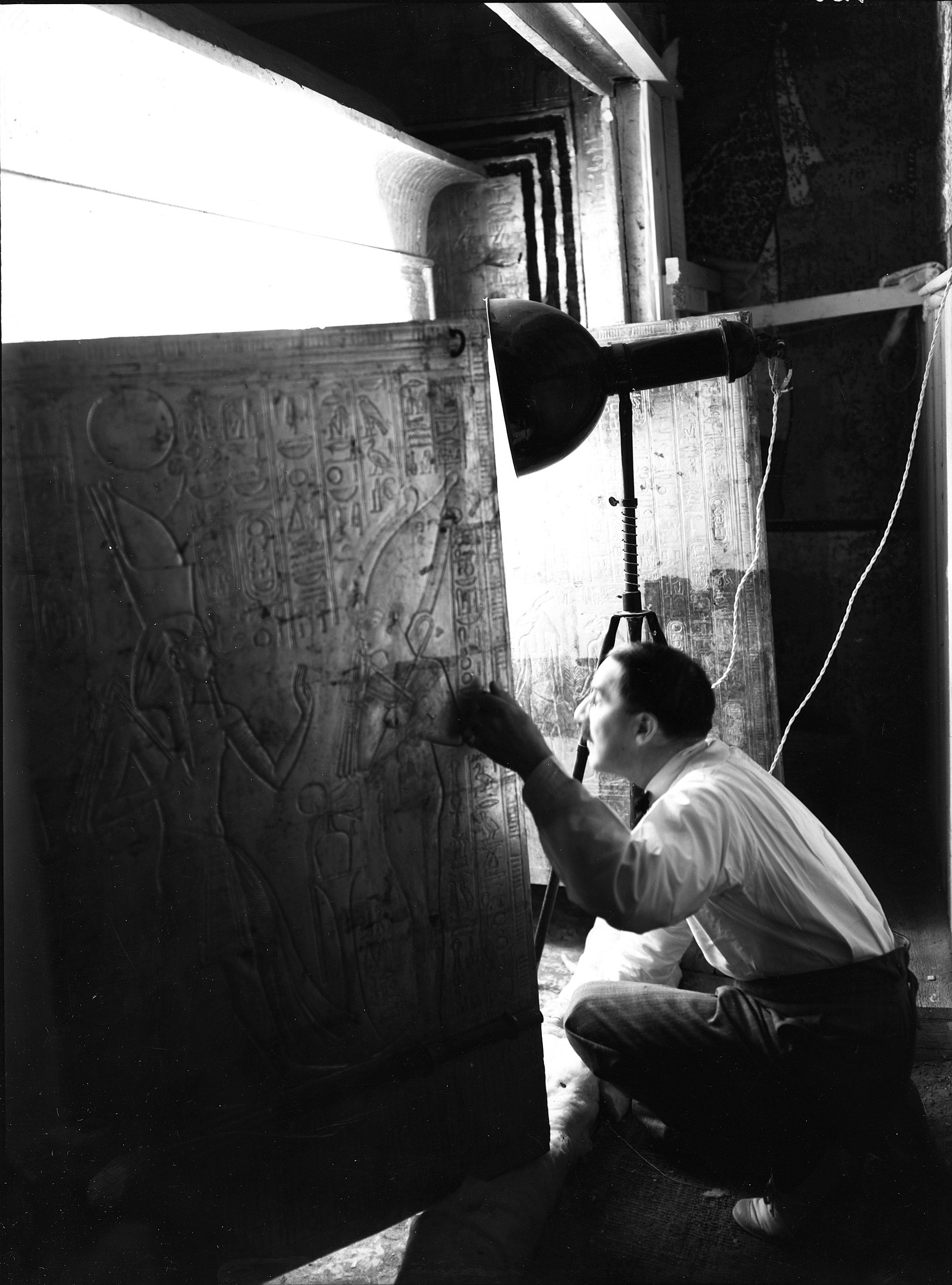 Howard Carter looking into Tutankhamun’s burial shrine in January, 1924.