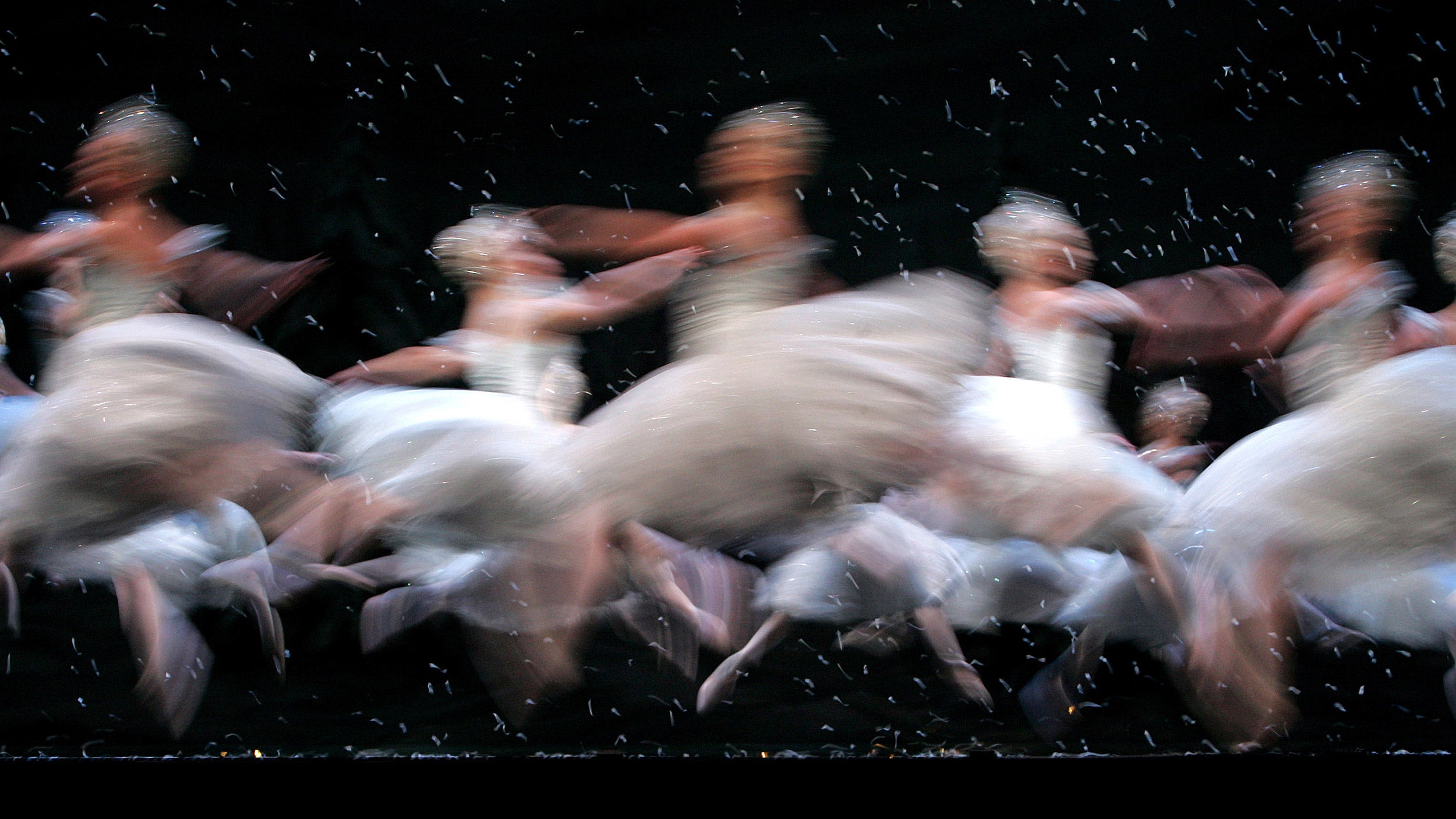 Ballerinas dance as snowflakes in "Nutcracker Ballet."
