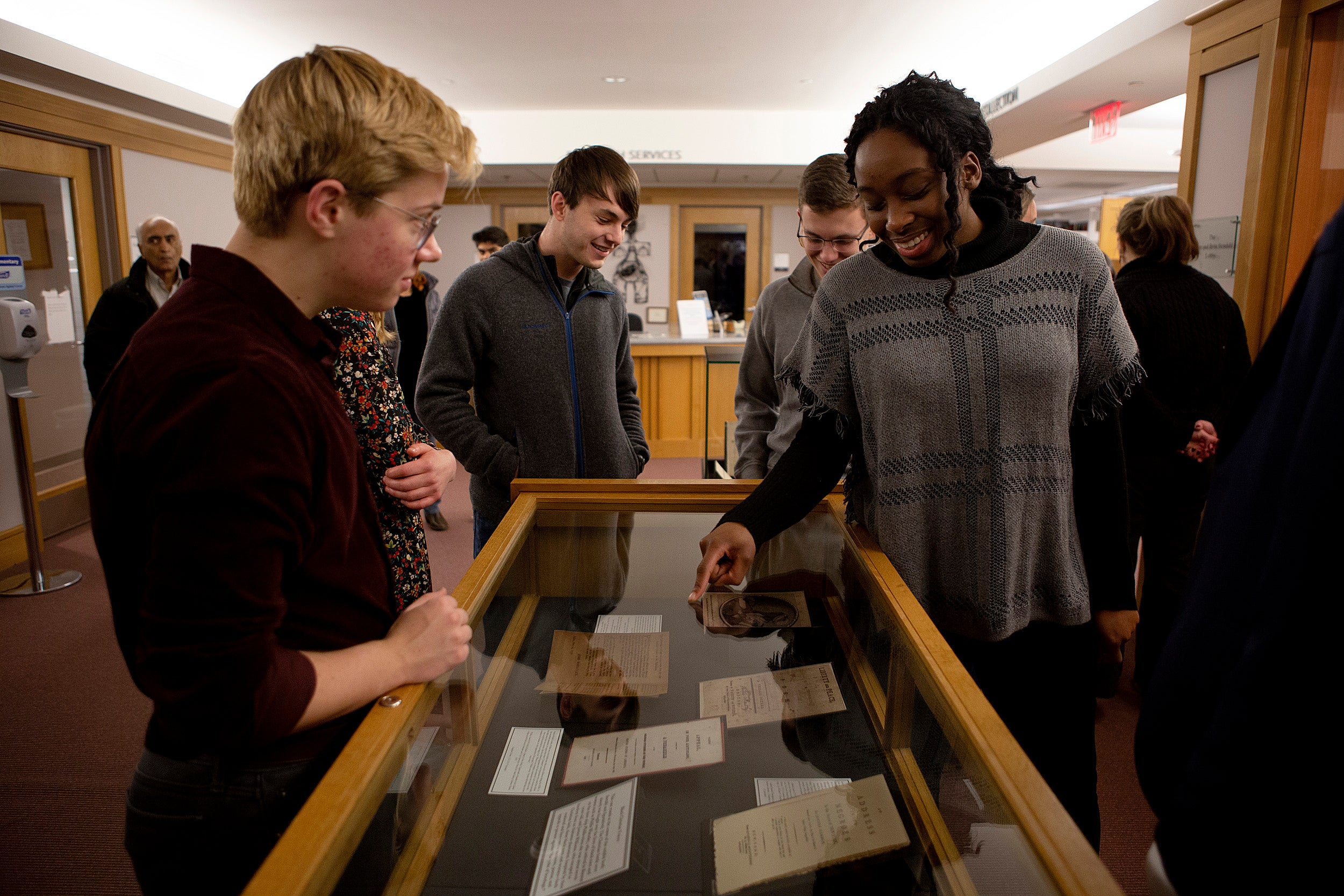 Alexandrea Harriott and classmates with their exhibit Andover-Harvard Theological Library .