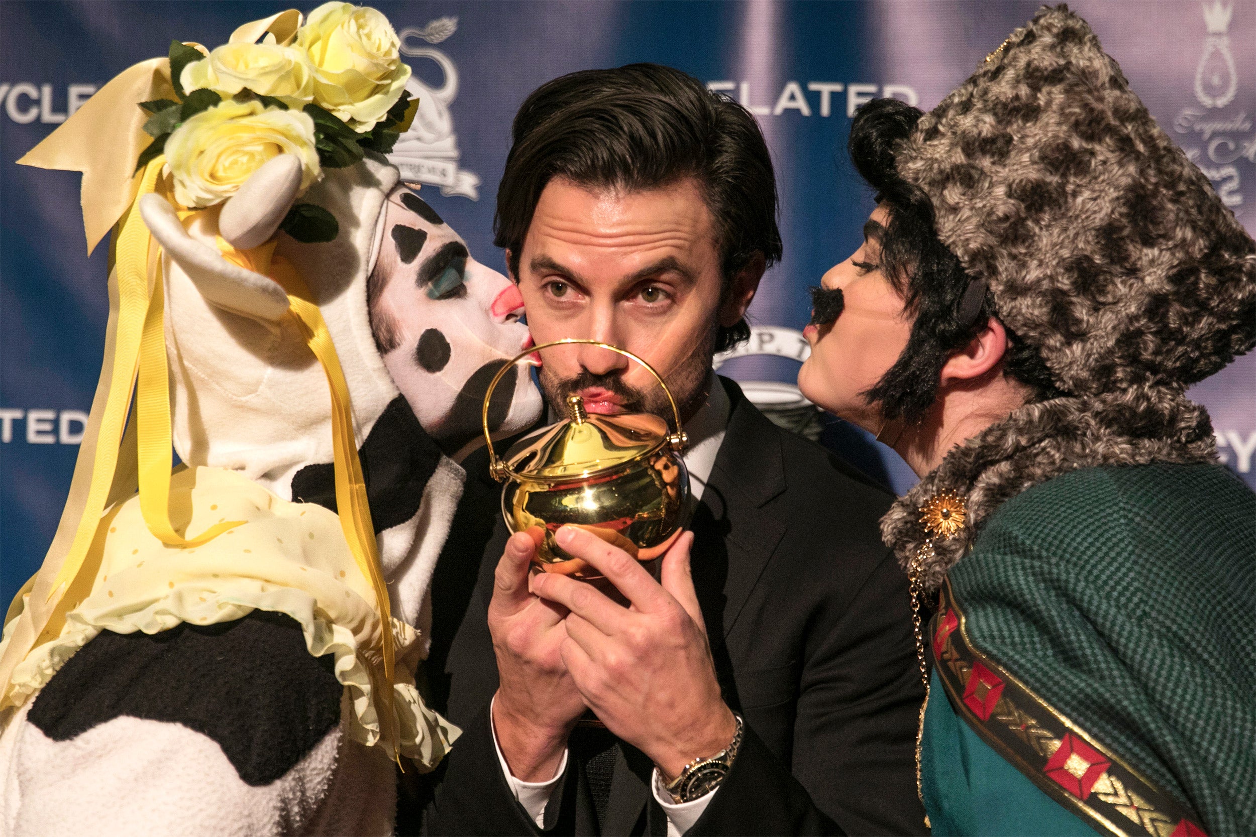 r Milo Ventimiglia kisses his pudding pot, flanked by Hasty Theatrical members Ryan Kapur '20 and Elle Shaheen '21.