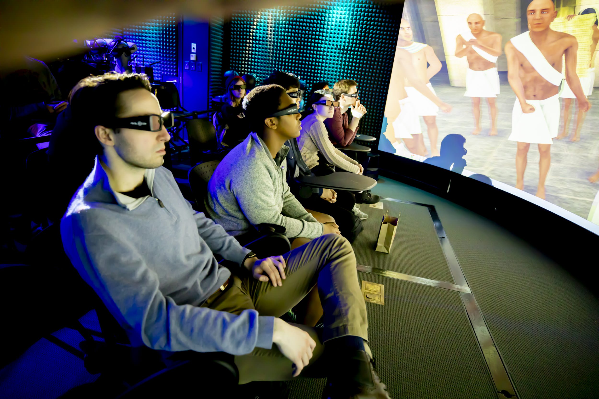 Students with 3D glasses watching a video