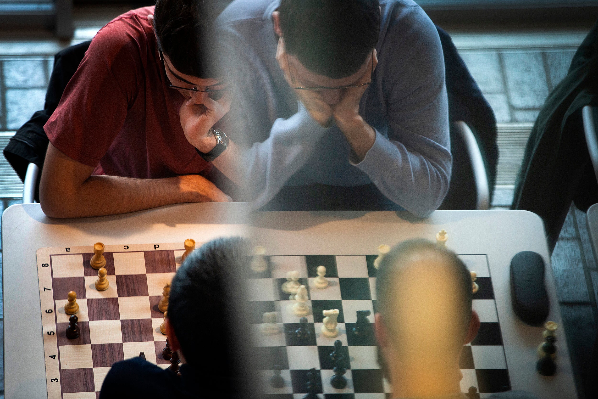 Chess players concentrate.