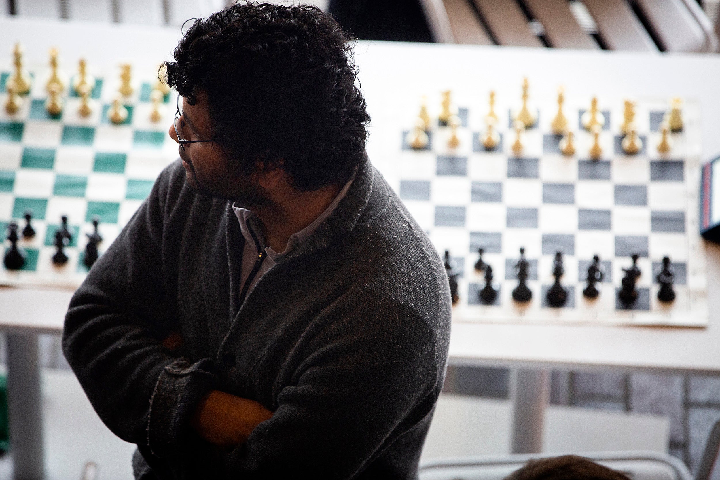 Natesh Pillai takes a break between chess matches.