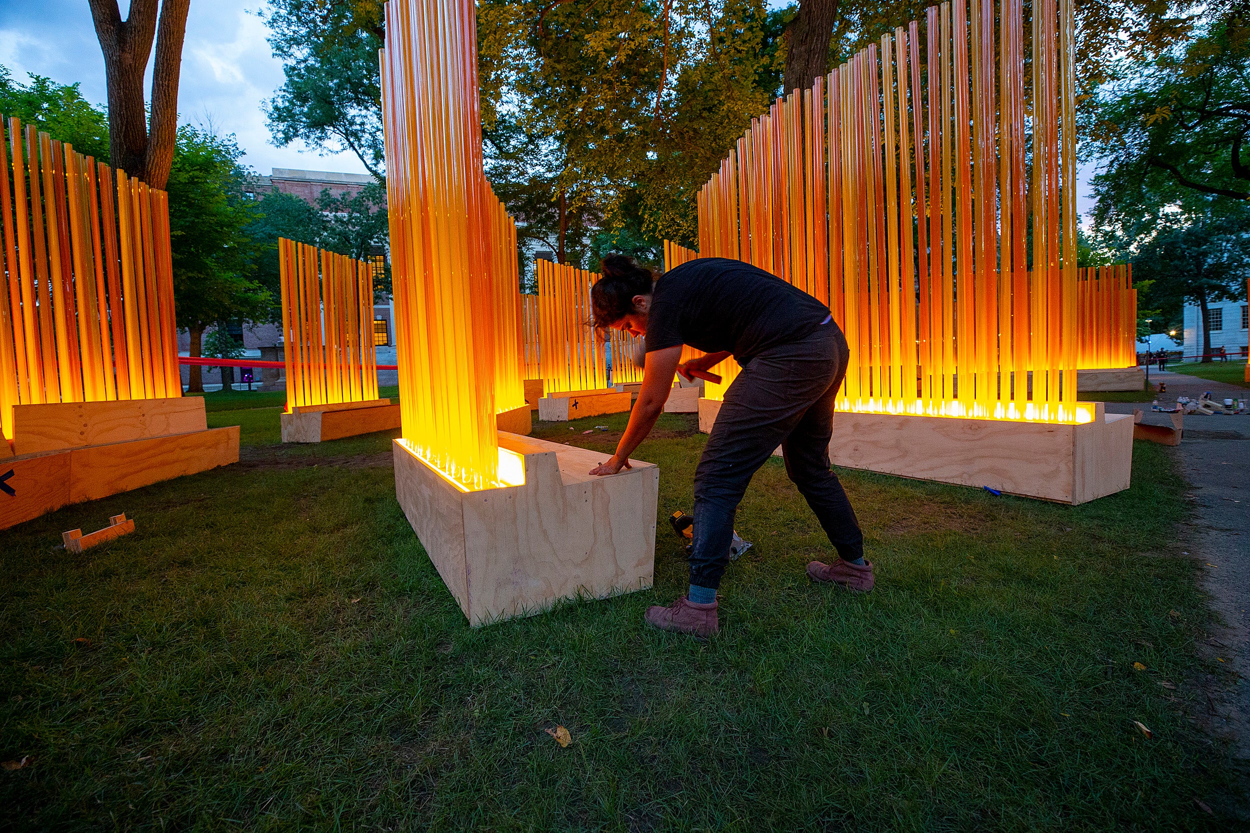 A woman putting the art installation together