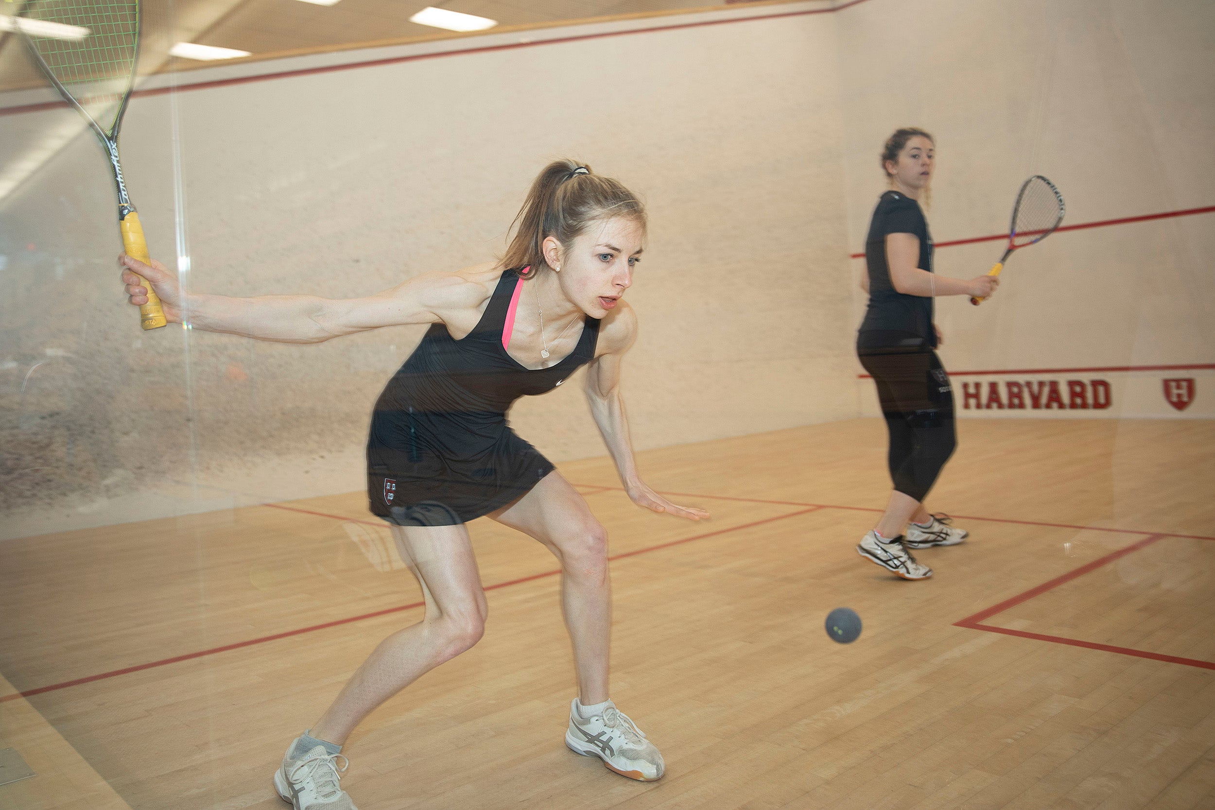 Amelia Henley holds a squash racket.