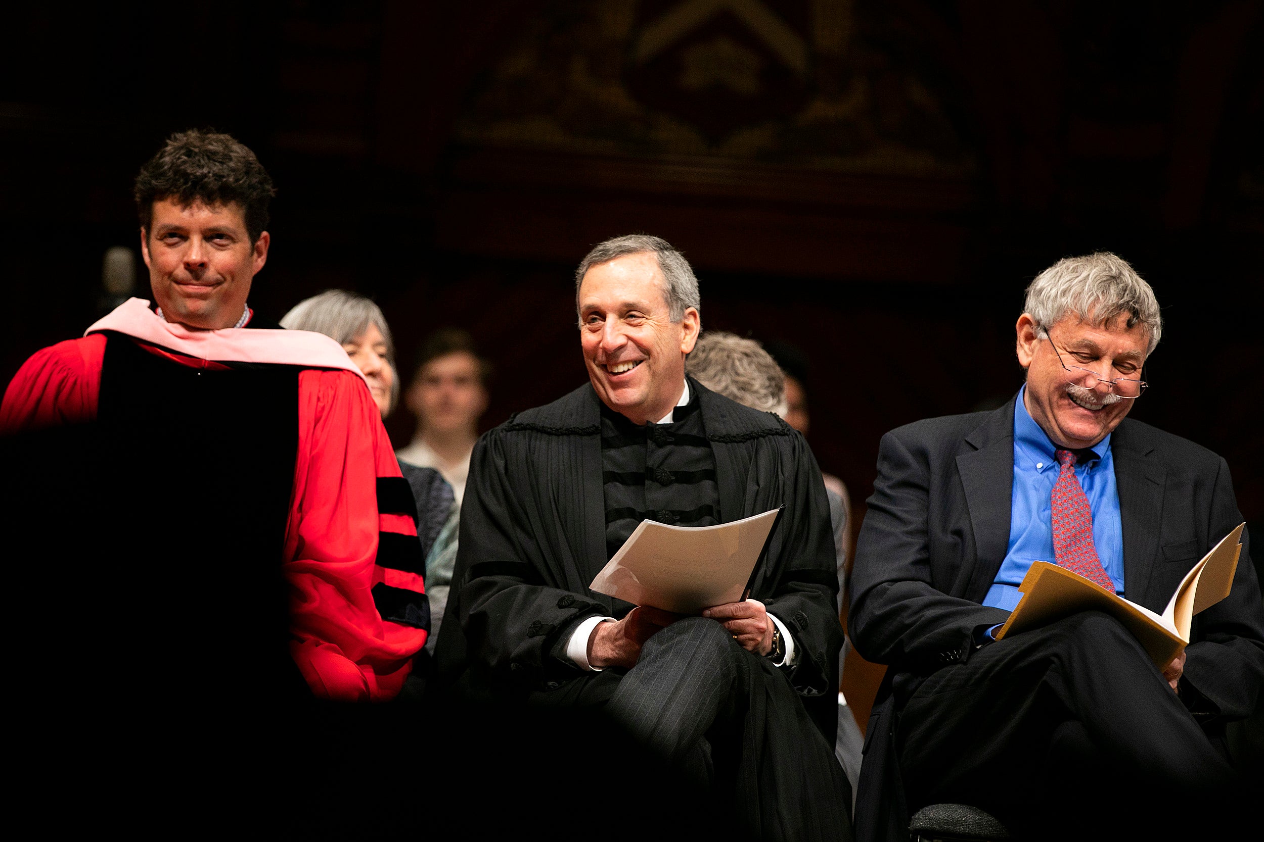Director of Choral Activities and Senior Lecturer on Music Andrew Clark (from left), University President Larry Bacow, and Eric Lander sitting together.