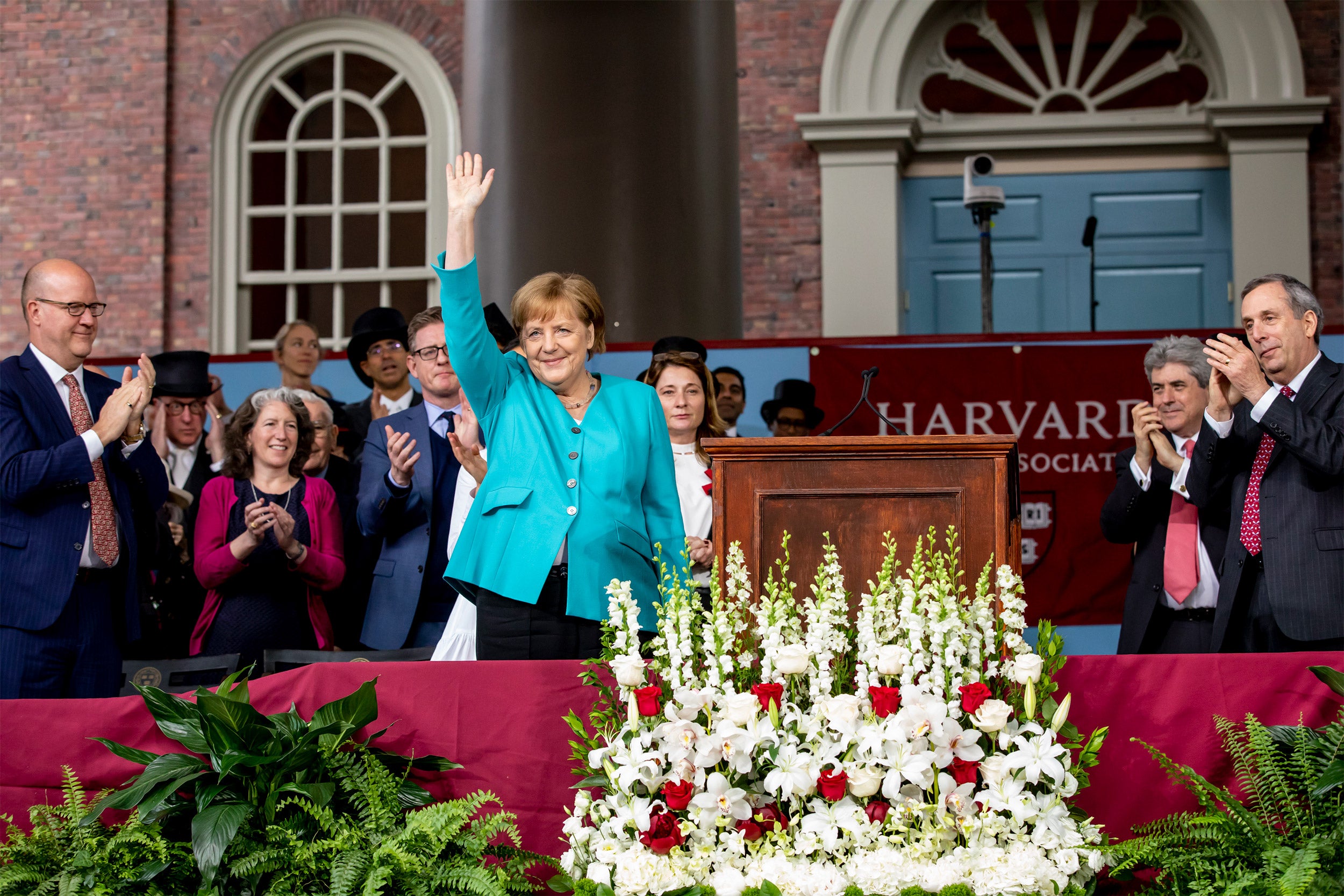German Chancellor Angela Merkel waving to the crowd.