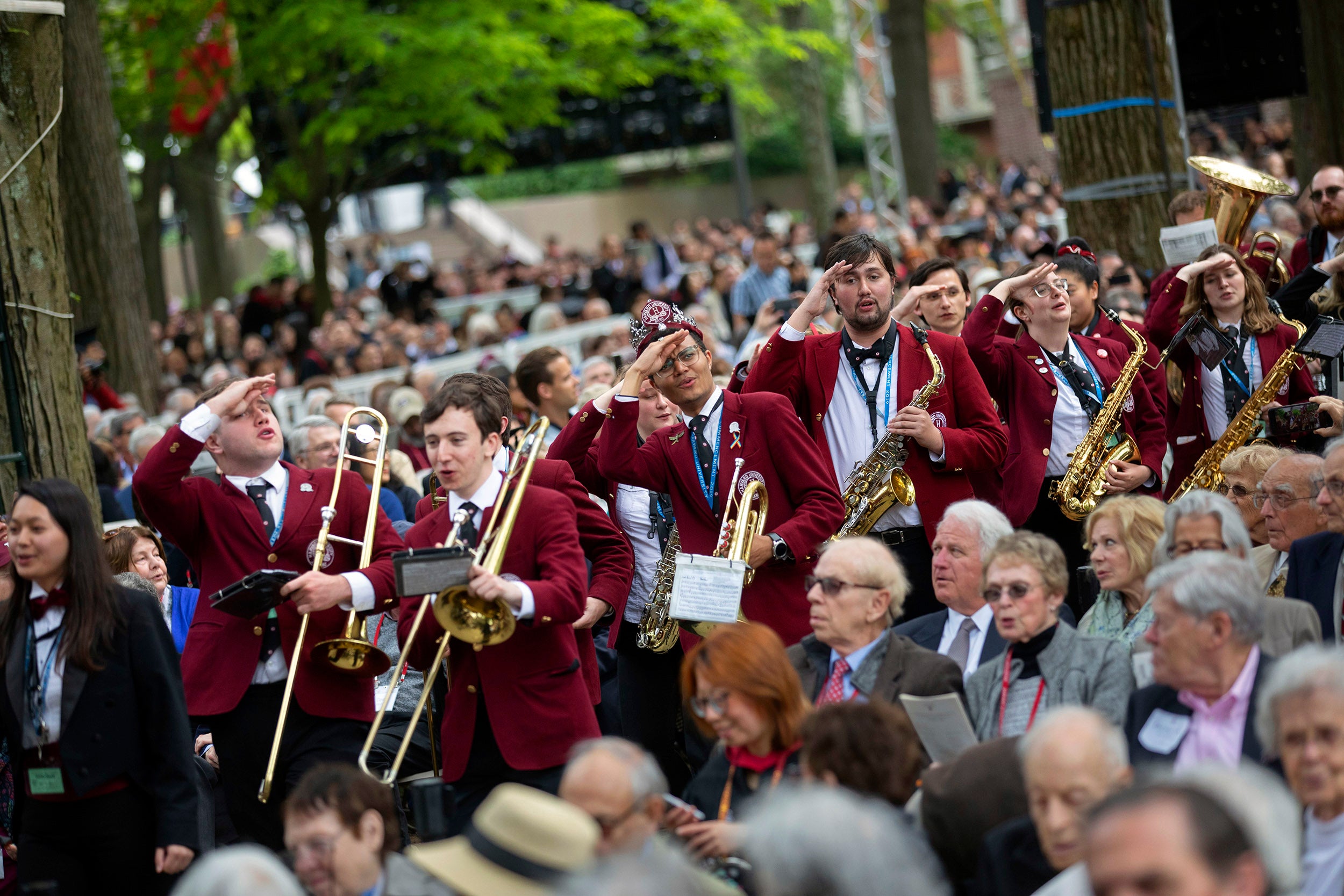 Members of the Harvard Band salute Harvard Alumni Association.