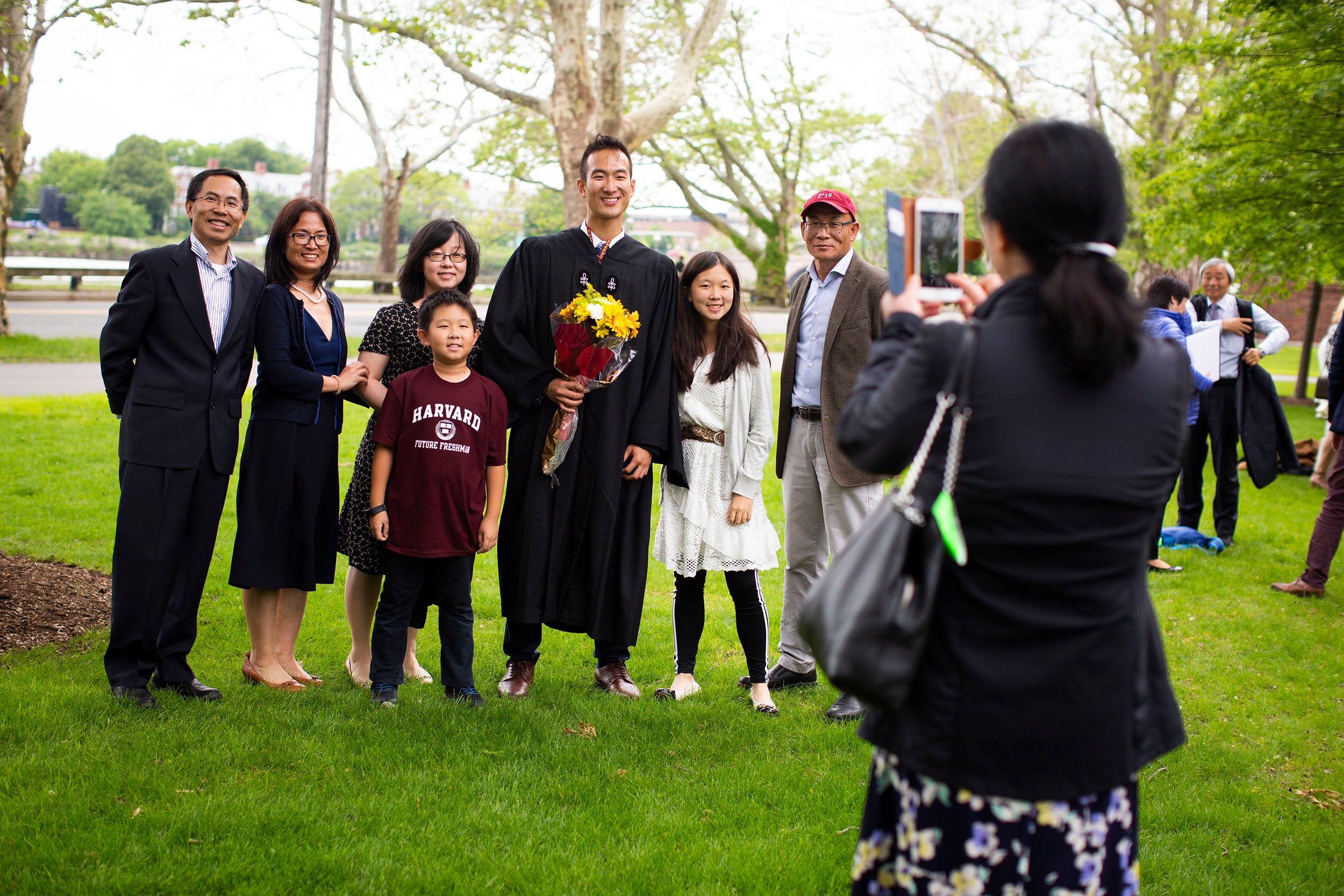 Graduate Michael Liu poses with his family for a photograph.