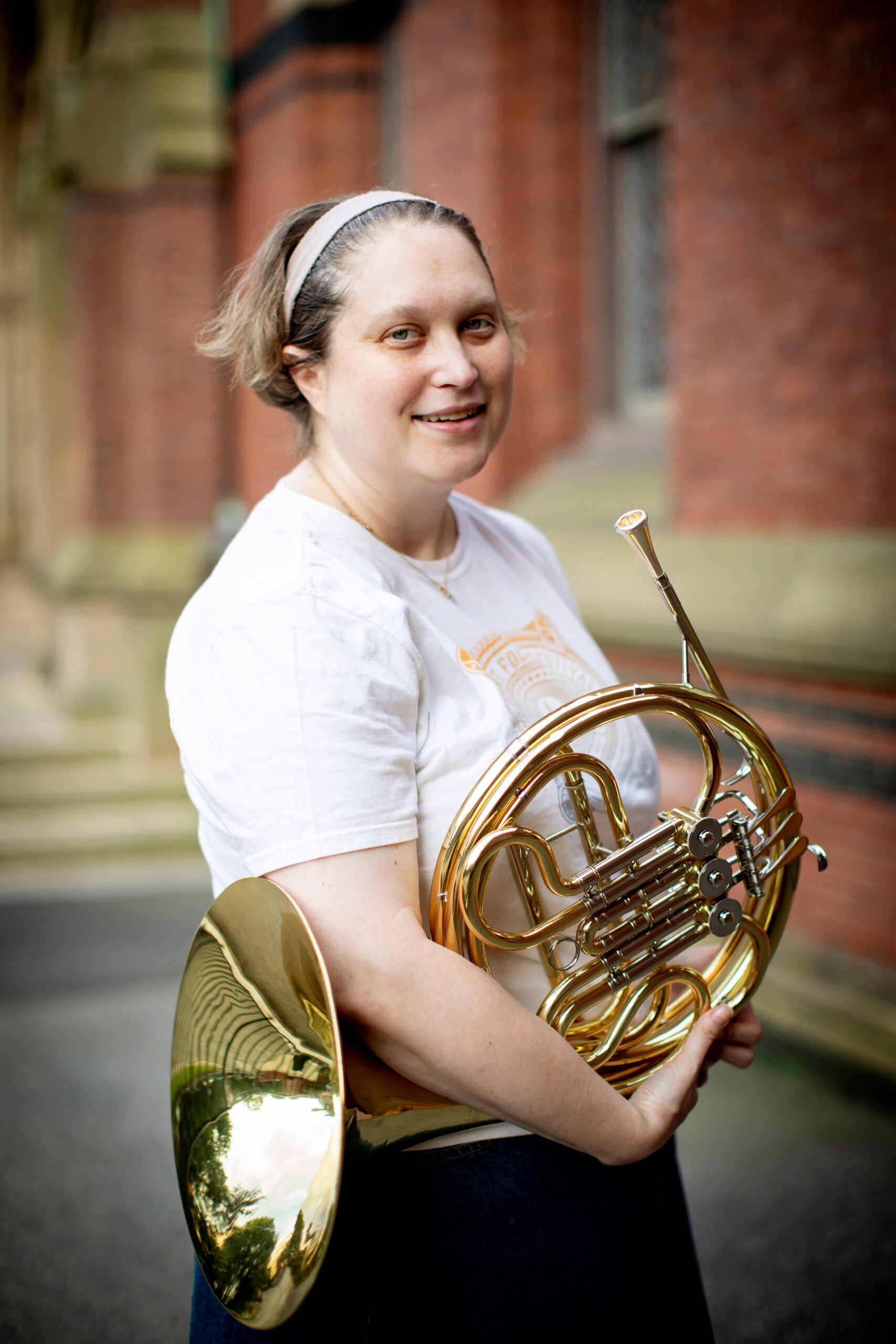 Jill Smith plays the French Horn in the band.
