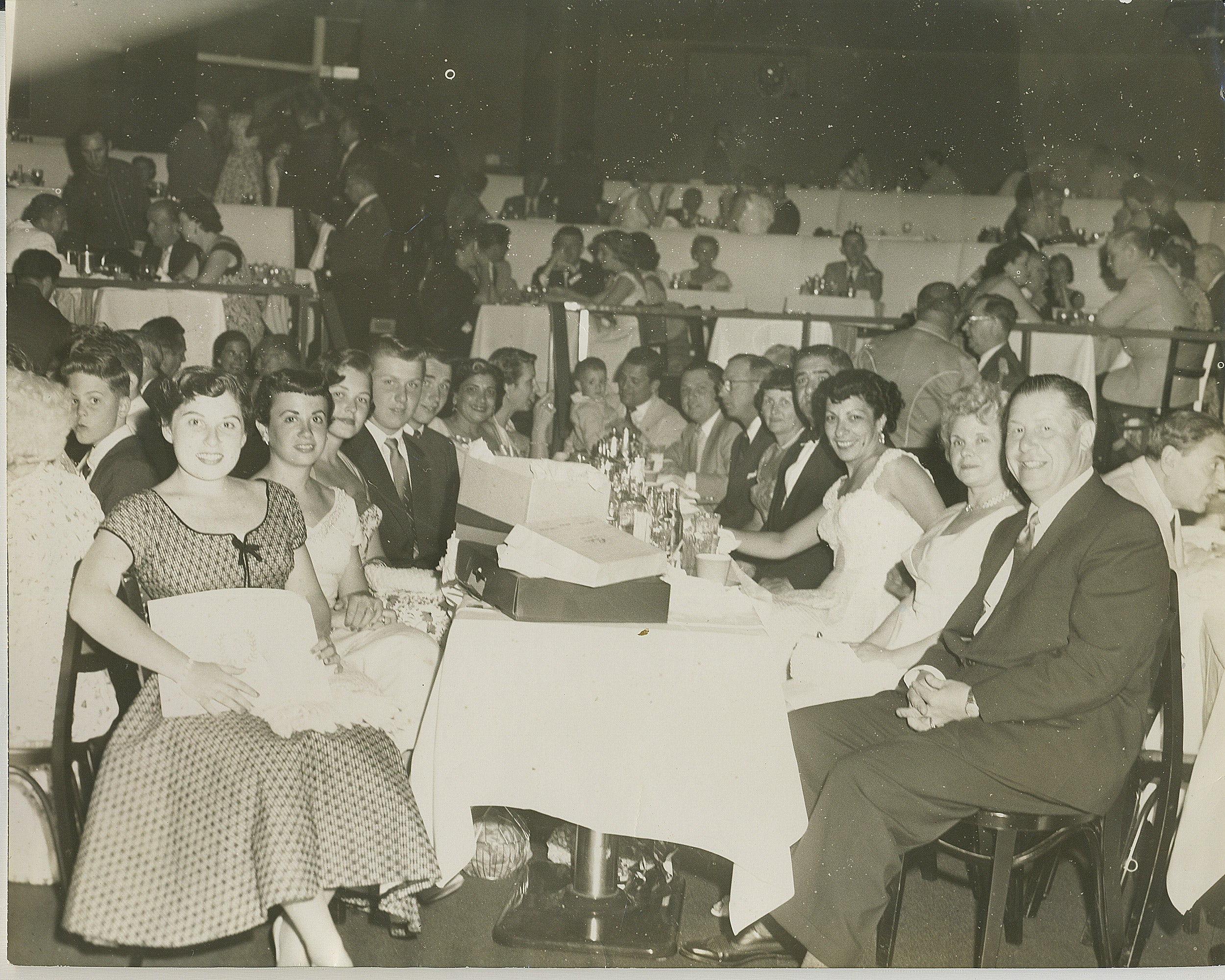 People sitting at a table at a celebration