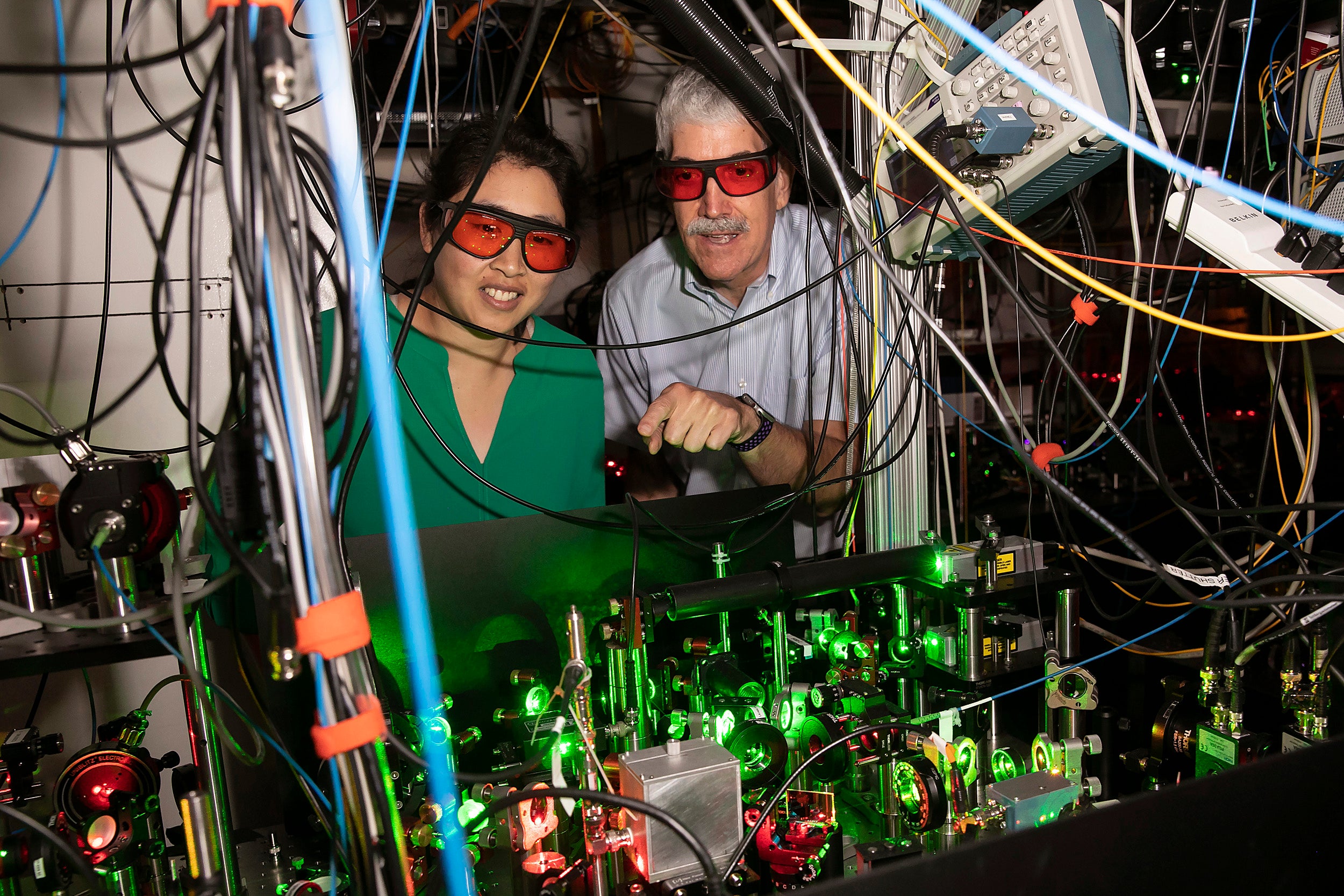 Using precisely focused lasers that act as optical tweezers