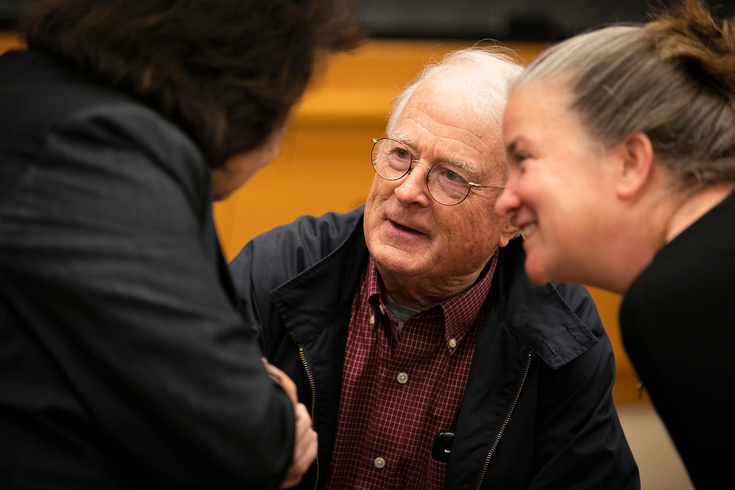 etsuko Thurlow (from left) speaks with Loring Conant '61, who went to Hiroshima as part of the Harvard Glee Club's trip in 1961, and Kathleen Sullivan