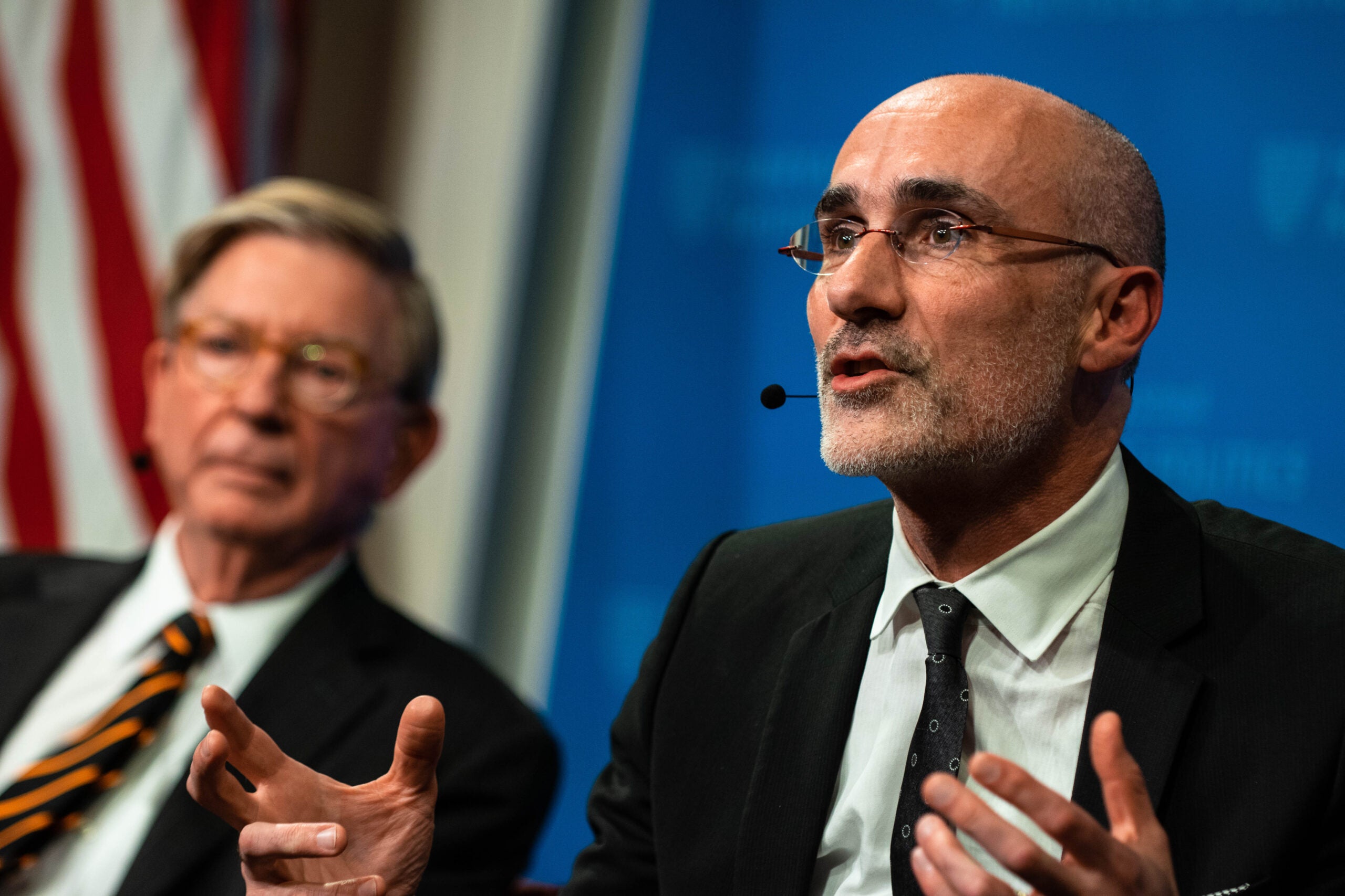 Harvard Kennedy School Professor Arthur Brooks with George Will in the background.