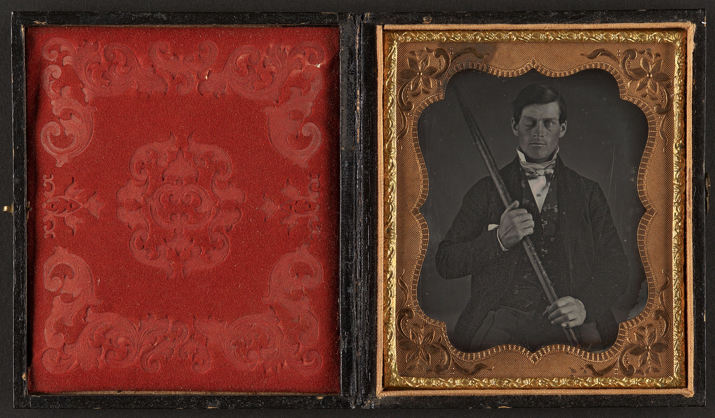 Black and white photo of Phineas Gage in a small black and gold frame